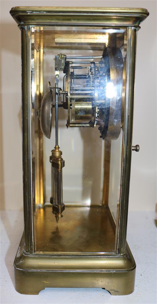 A Victorian brass four glass mantel clock, 12in.